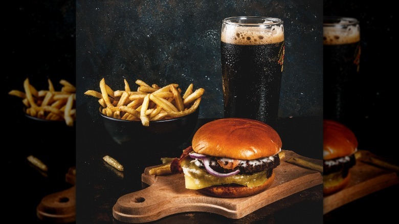 burger and fries with glass of stout