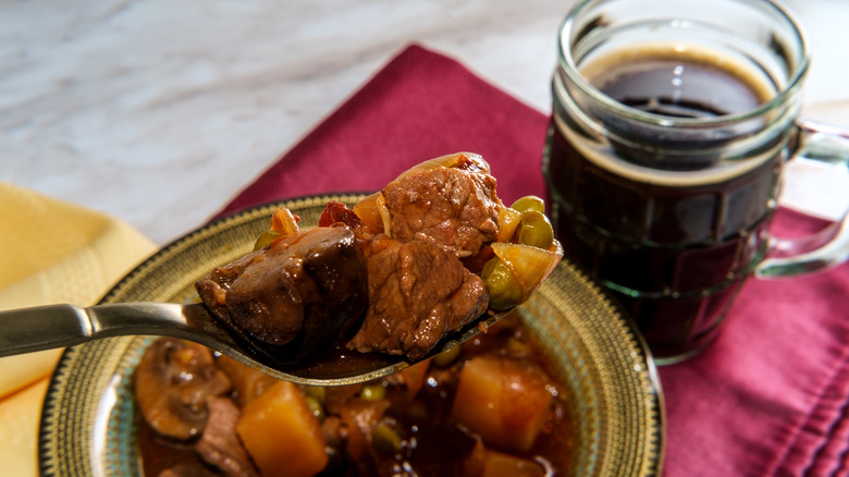 bowl of irish beef stew and glass of stout