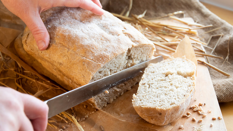 slicing loaf of bread