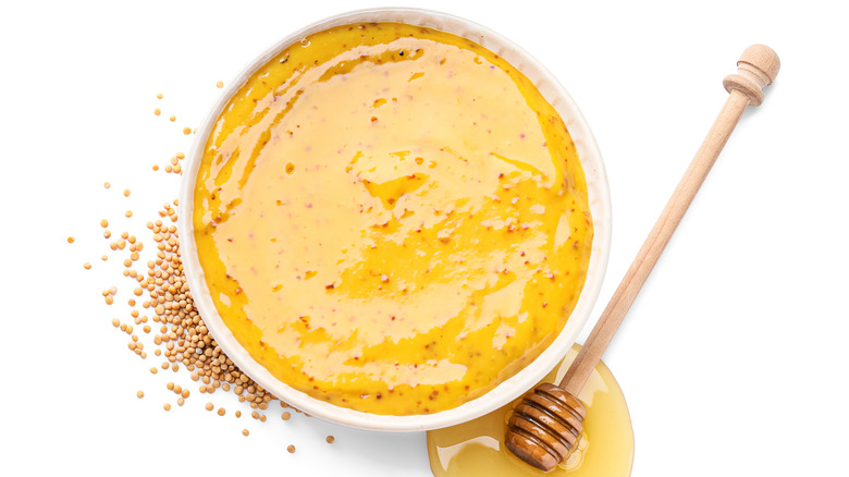 Honey mustard dressing in white bowl