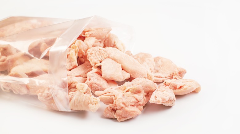 Frozen chicken pieces in bag