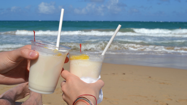 Two piña coladas at the beach