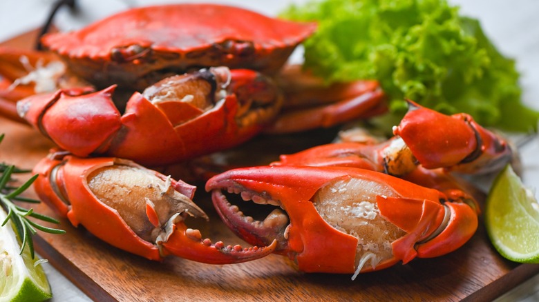 cooked crab on cutting board