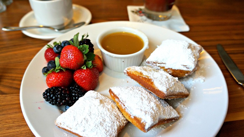 beignets with berries and sauce