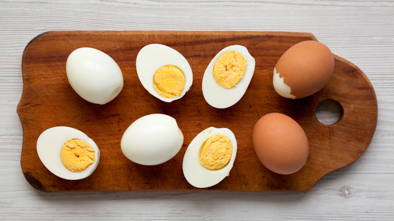 hardboiled eggs on wooden board