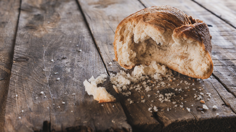 Old bread on wooden table