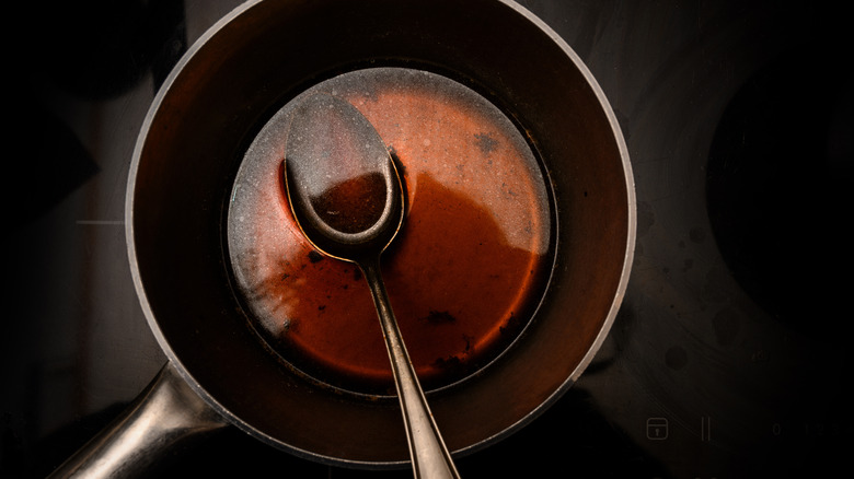 pot of broth and spoon