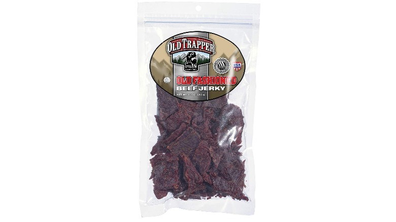 A bag of Old Trapper beef jerky against a white background