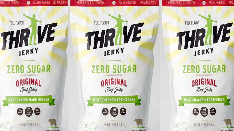 Three bags of Thrive beef jerky against a white background