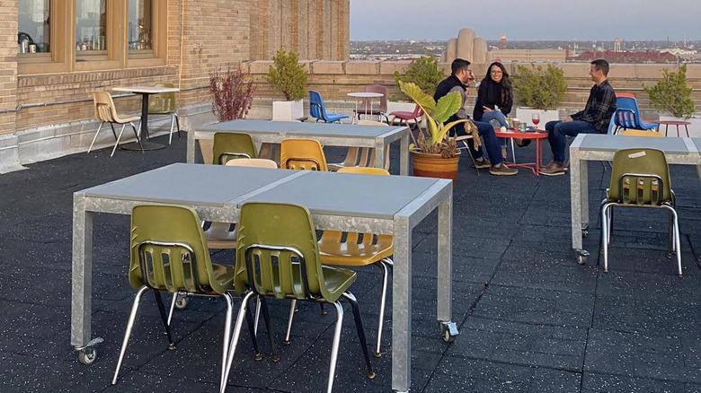 Tables and chairs on rooftop patio