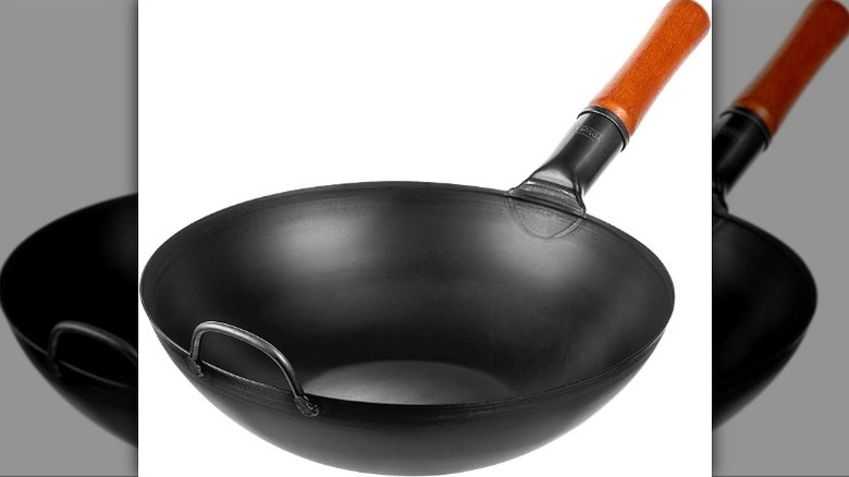 black steel wok with wooden handle