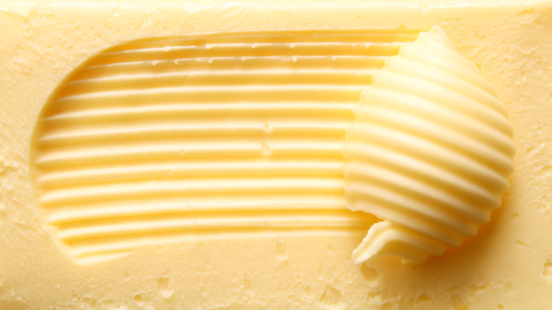 Butter scraped with utensil