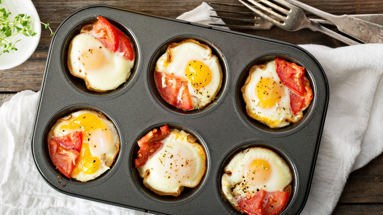 Eggs with tomatoes in muffin tin