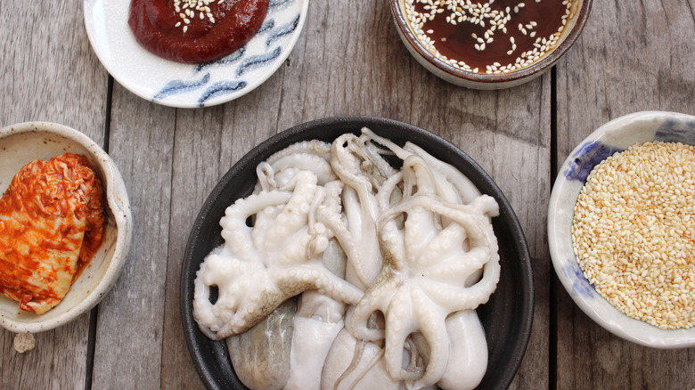 bowl of octopus with side dishes