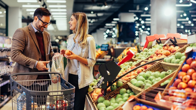 Man and woman shopping for groceries