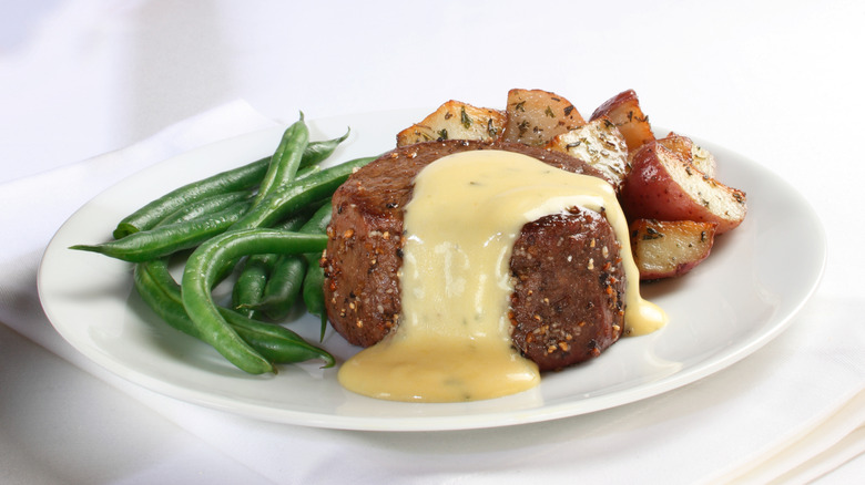 plate of filet mignon steak with Béarnaise sauce