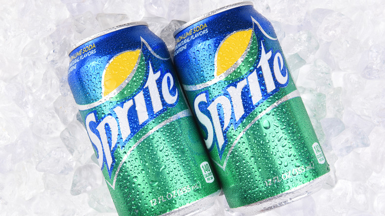 Two Sprite cans on ice