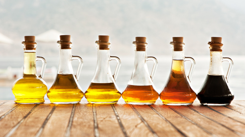 Bottles of different colored vinegars