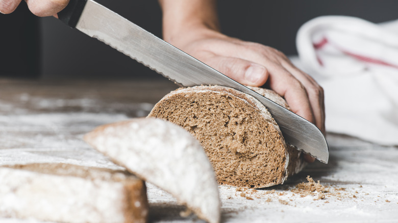 Cutting bread with bread knife