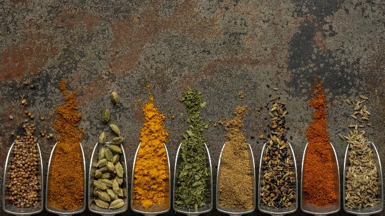 Spices spilling out of scoopers