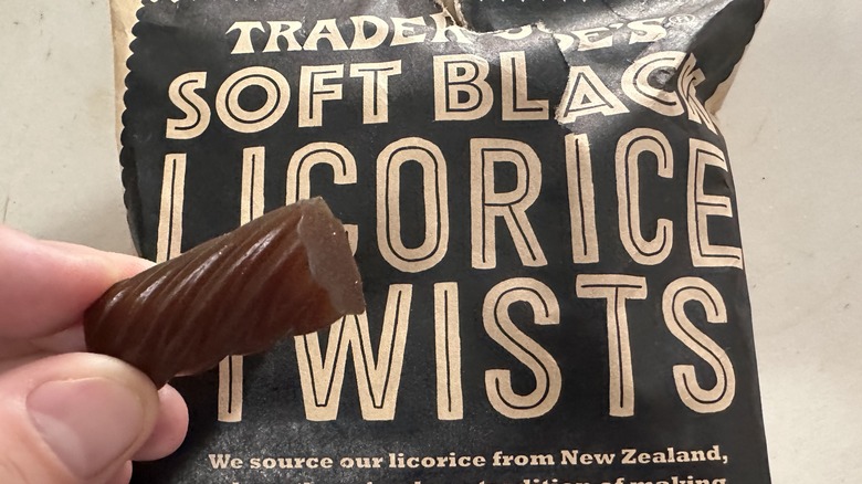 bag of black licorice and a piece of licorice