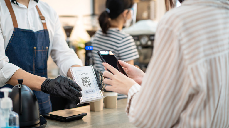 customer scanning QR code to pay