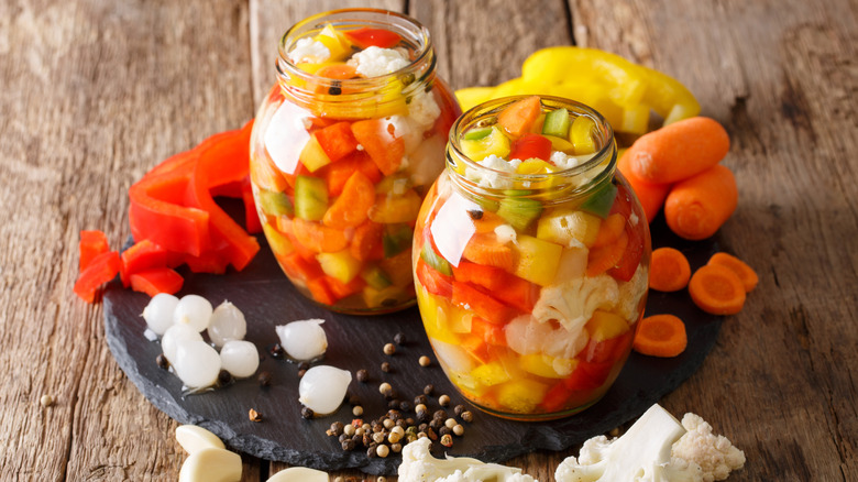 clear jars of giardiniera