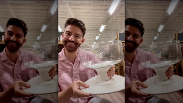 A person holding a cake stand turned punch bowl