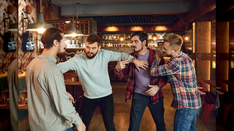 Bar patrons getting ready to fight