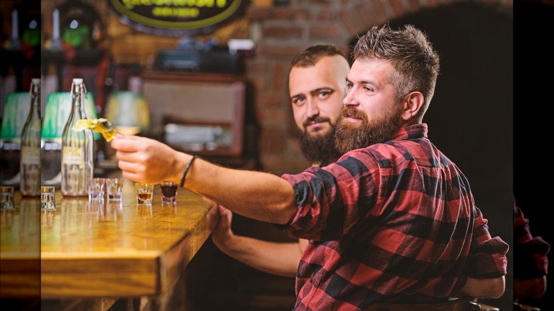 Bar patron providing a tip