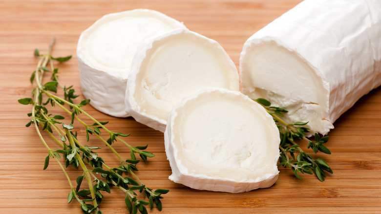 Sliced goat cheese with fresh thyme