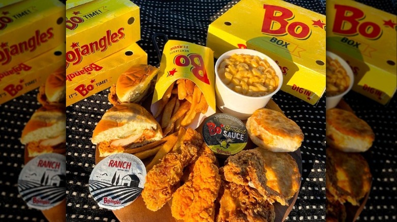 Yellow Bojangles boxes with fried chicken meal