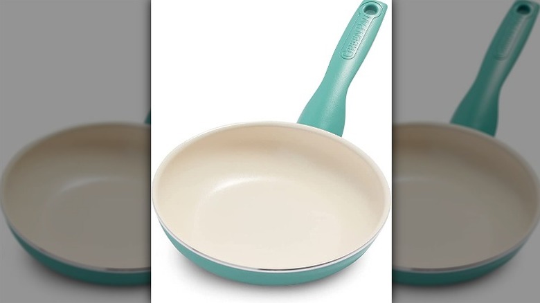 green and white frying pan