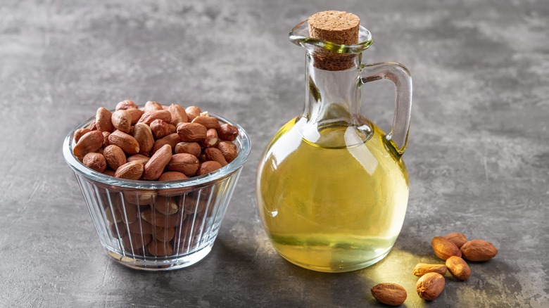 peanut oil next to dried peanuts