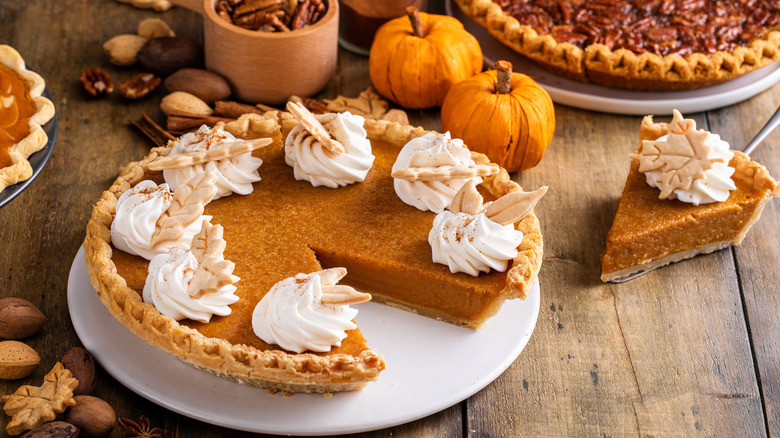 Pumpkin pie in a festive Thanksgiving setting