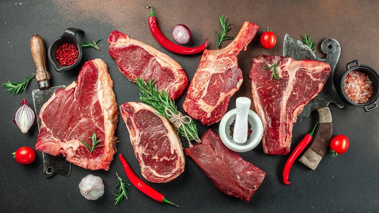 selection of large raw steaks