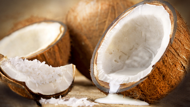 Halved coconuts with milk