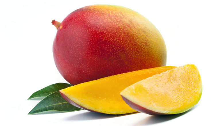 Whole mango and slices