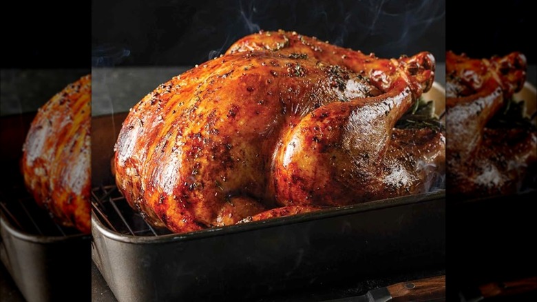 Whole roast turkey in dish