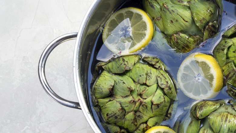 pot of artichokes in water