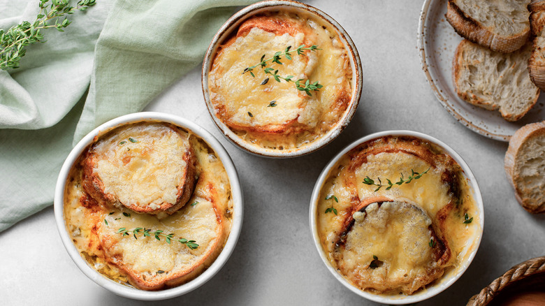 Three bowls of French onion soup