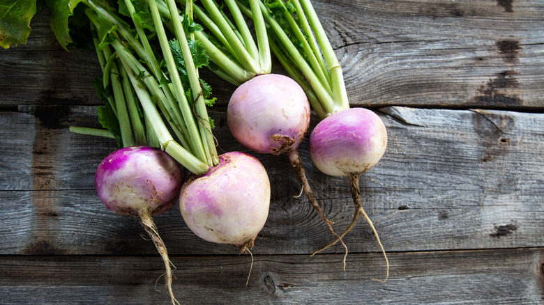 turnips on wood background