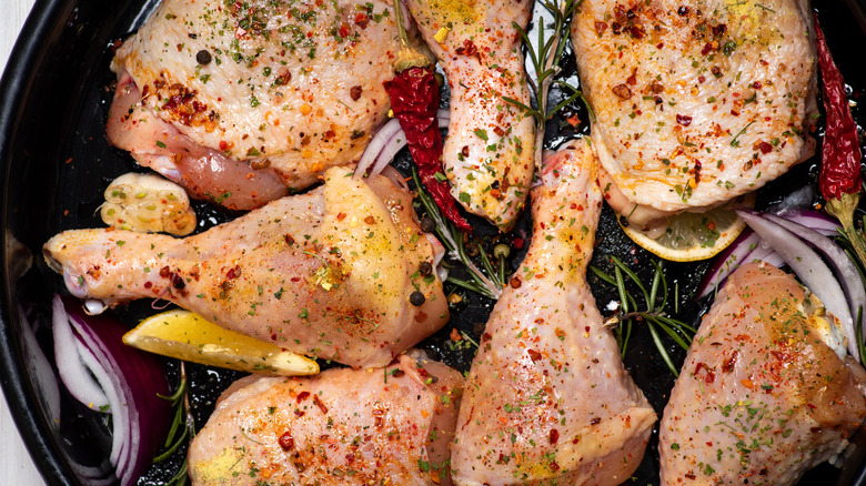 seasoned chicken thighs in pan