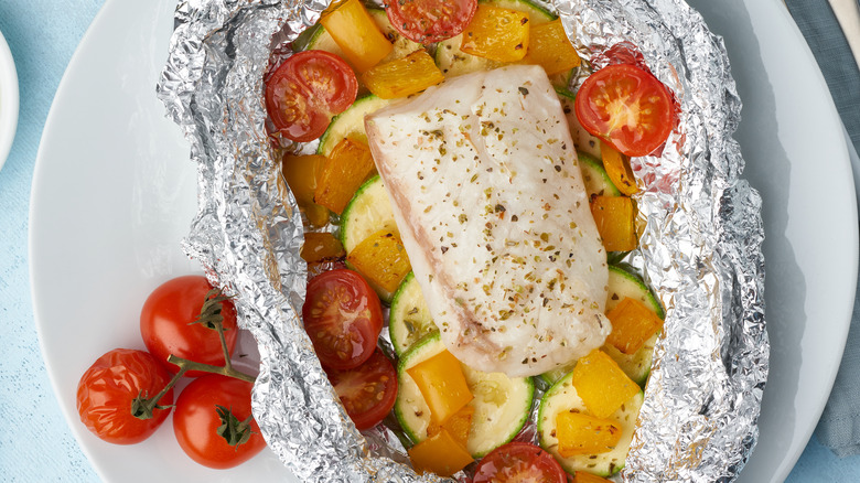 Fish and tomatoes in foil