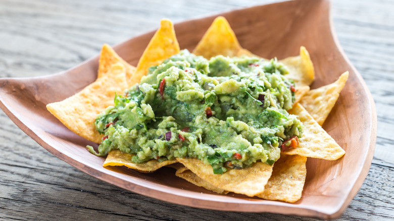 Tortilla chips topped with guacamole