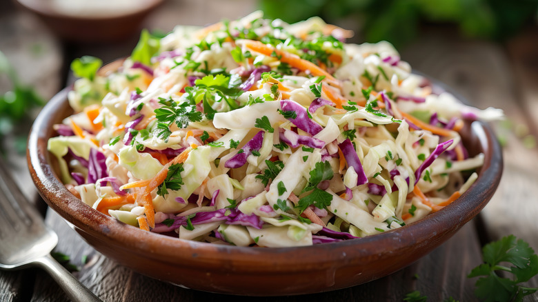 Bowl of coleslaw on table