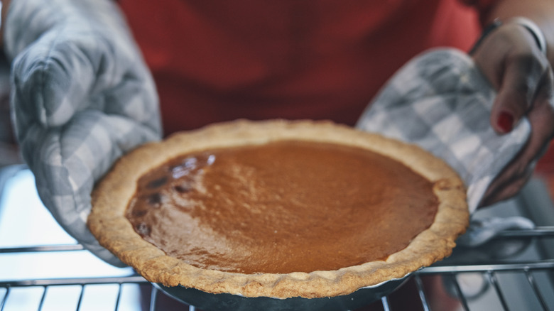 pumpkin pie on rack