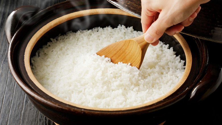 rice being stirred with spatula