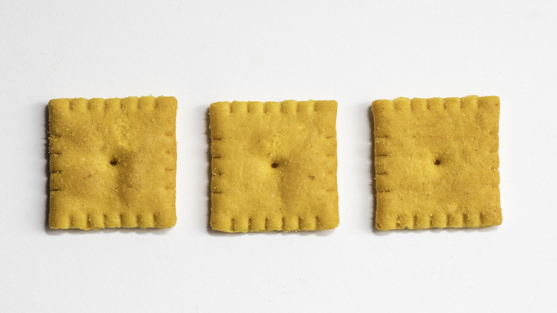 A line of three cheese crackers