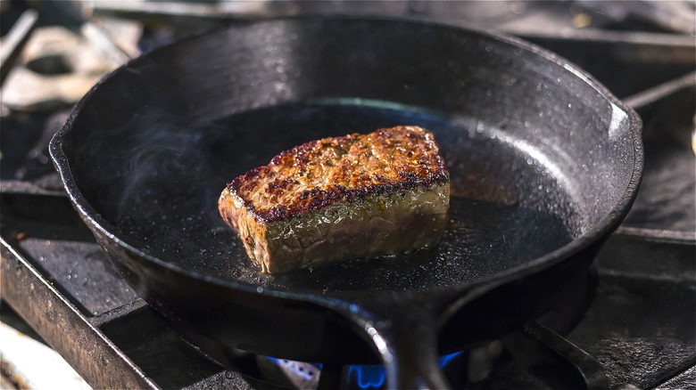 Seared steak in cast iron skillet 